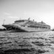 grayscale photo of cruise ship on sea