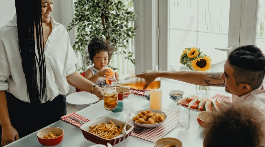 woman in white shirt holding a girl in white shirt